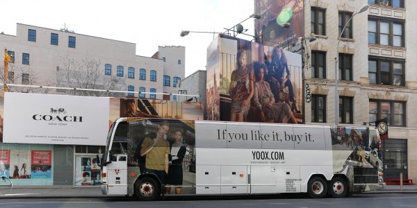 Bus wrapped with bus ad for Yoox.com as example of Trailways transit advertising opportunities